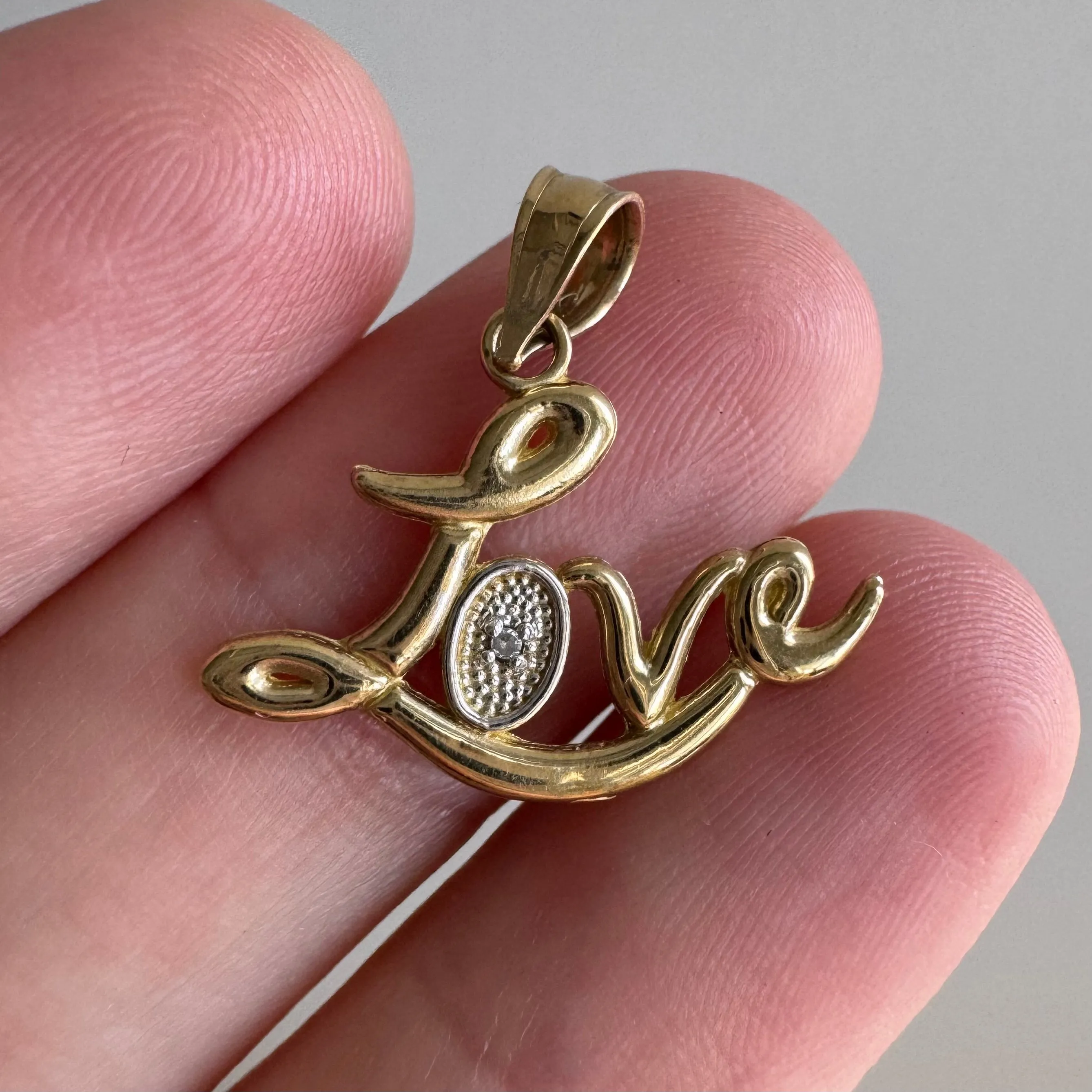 P R E - L O V E D // flowing LOVE / 10k yellow gold and tiny diamond love word / a pendant